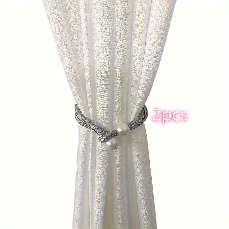 Fashionable and simple curtain binding rope available in 1 piece or 2 pieces. This decorative rope features creative pearl accents, adding beauty to your curtains. Use it as a decorative curtain buckle or binding strap for a simple and elegant touch.