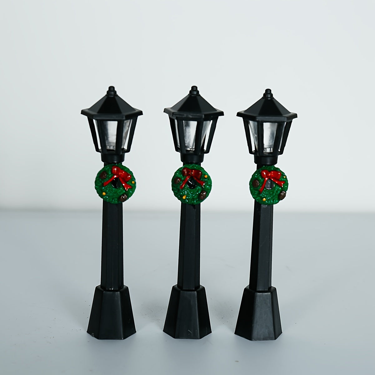 3 Miniature Christmas Lamp Posts with Wreaths, Collectible Seasonal Figurines, Plastic Material, No Electricity Needed