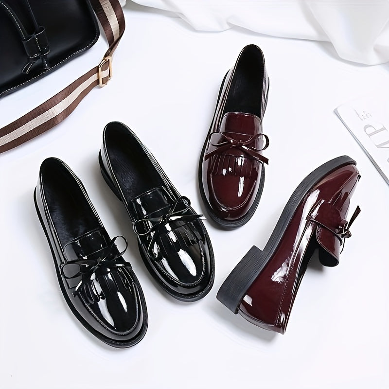 Women's slip-on shoes with preppy English style, solid color, round toe, and bow embellishment. Made of man-made materials with PVC insole and fabric inner material. Hand wash only.