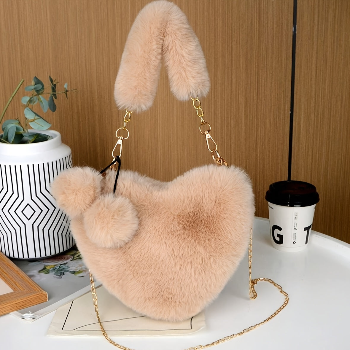 Elegant plush heart-shaped shoulder bag with zipper closure and detachable strap, ideal for Valentine's Day gift. Comes in khaki/white/red/black.