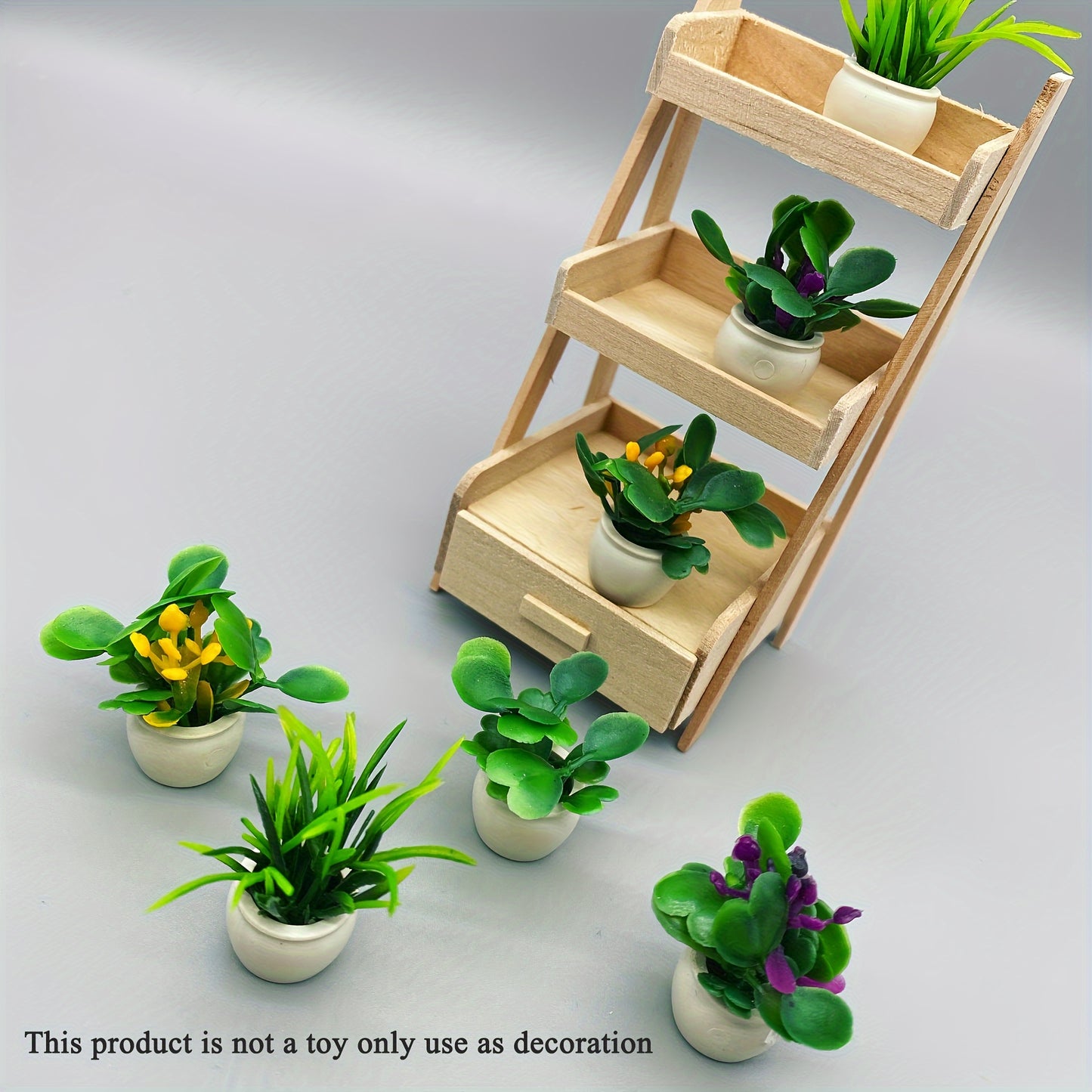 Set of 5 artificial mini potted plants for dollhouse decor or garden decoration.