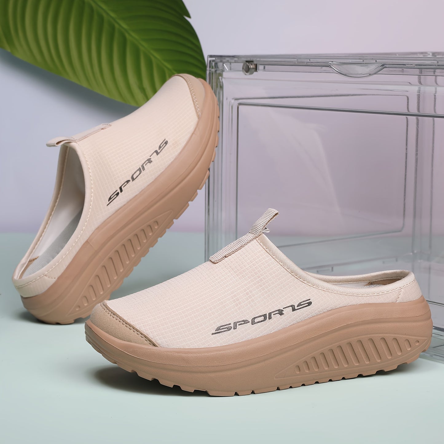 Breathable knit slip-on sneakers with a comfortable EVA rocker sole, beige with sporty logo, suitable for all seasons. Casual low-top design. Durable footwear and shoe accessories.