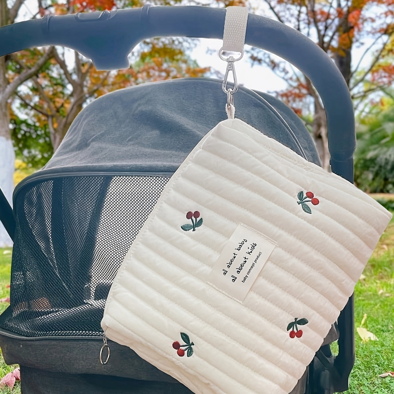 Travel in style with our Embroidered Cotton Travel Carry Bag designed specifically for strollers. This multi-function organizer features compartments for bottles and diapers, providing convenient storage for parents on the go. Suitable for ages 14 and