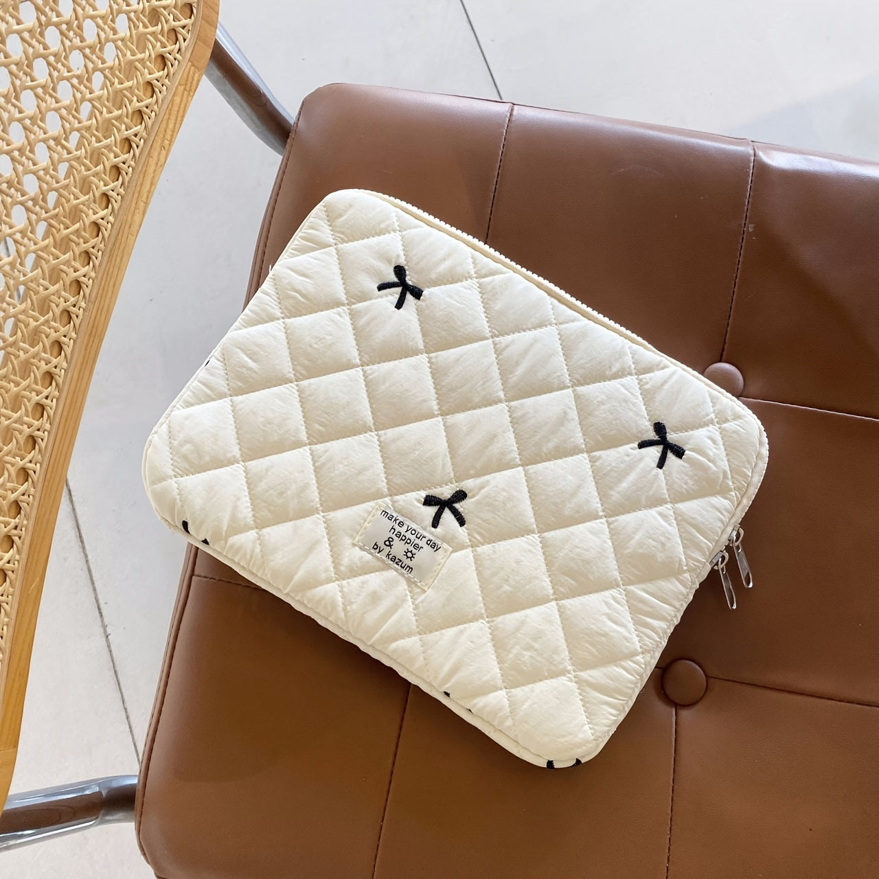 One laptop bag with ballet style bow embroidery, suitable for various devices.