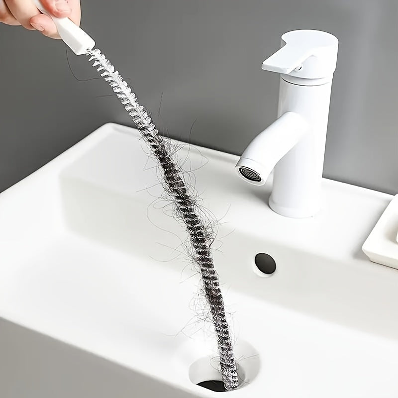 Introducing a versatile drain cleaning brush specially crafted for unclogging kitchen and bathroom pipes. This tool boasts an ergonomically designed handle for easy gripping, a reusable socket tool, and operates without the need for electricity.