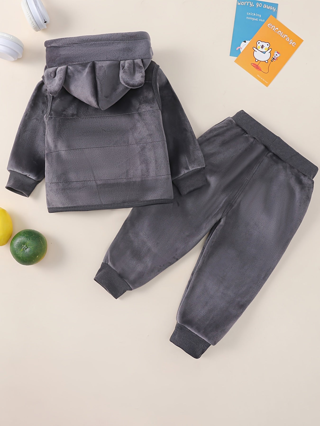 HIBOBI 3 piece toddler boy outfit set with bear appliqué top, hooded jacket, and pants made of 100% polyester with slight stretch. Regular fit for fall/winter and outdoor wear.