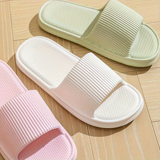 Gender-neutral EVA pillow slides with solid color, lightweight soft sole for home and beach comfort.