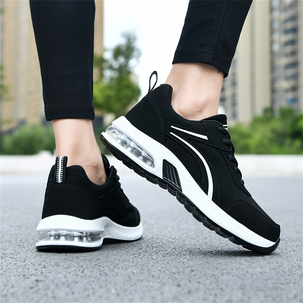 Women's casual sneakers made from black synthetic leather, featuring a lightweight design, air cushion support, lace-up style suitable for work, travel, or sports. Stylish and breathable