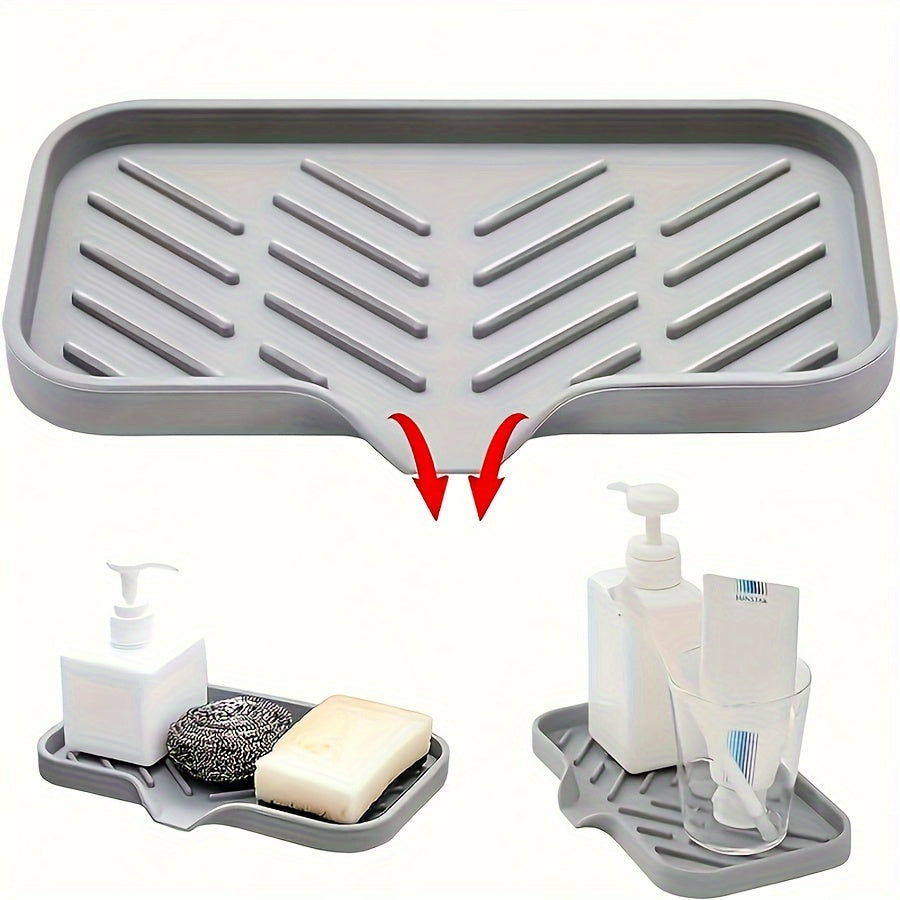 Silicone sink mat with soap dispenser, sponge drain, and countertop storage tray for drying and organizing bathroom accessories.