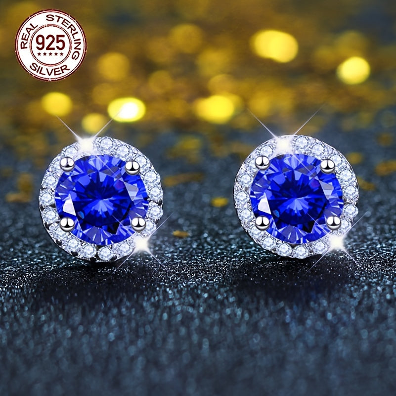 A beautiful pair of royal blue Tanzanite stud earrings in an elegant vintage style. Made from 925 sterling silver and featuring synthetic stones, these earrings are hypoallergenic and perfect for special occasions like weddings, gifting, Valentine's Day