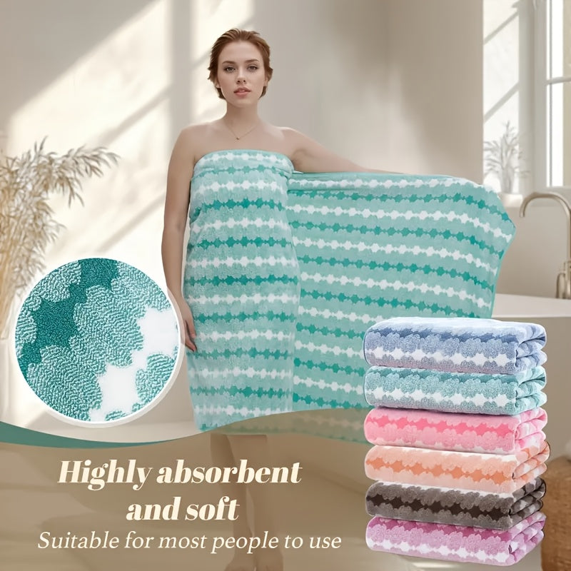 One set of extra large and small bath towels for women made of super soft, absorbent coral velvet with a modern design and strong absorbency.