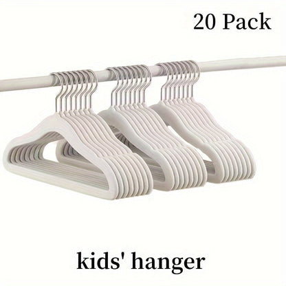 The HOUCOC 20-piece Velvet Hangers Set is Perfect for Organizing Kids' Clothing in the Closet - Non-Slip and Space-Saving Solution for Pants, Shirts, and Dresses for Children and Teens.