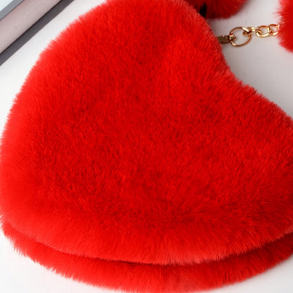 Elegant plush heart-shaped shoulder bag with zipper closure and detachable strap, ideal for Valentine's Day gift. Comes in khaki/white/red/black.