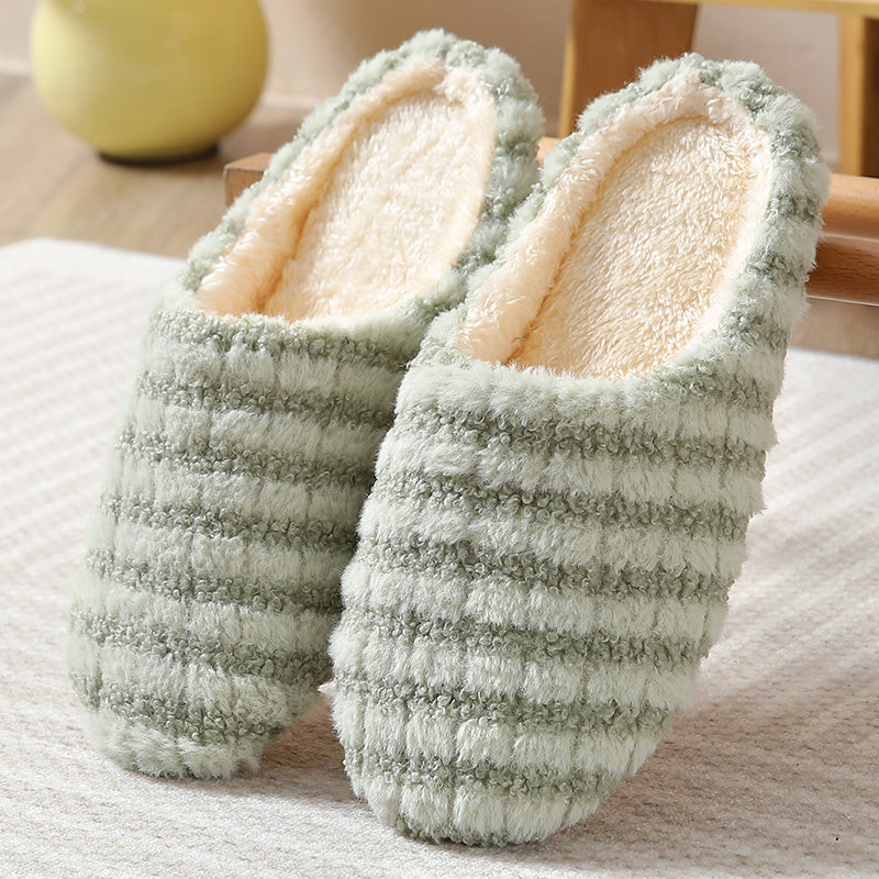 Women's striped print plush house slippers with anti-slip sole for indoor use.