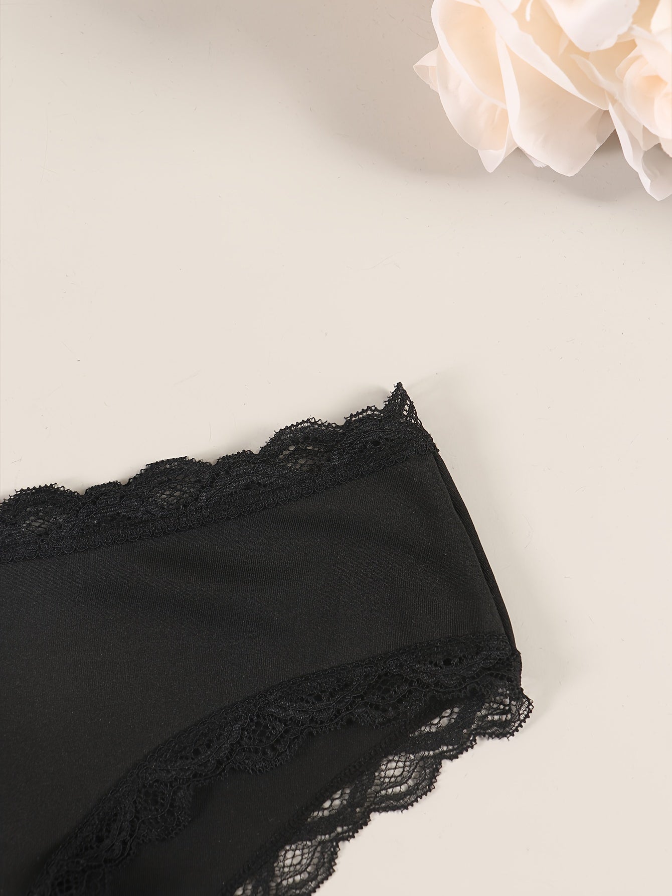 Sexy lace women's panties with delicate lace trim, comfortable and breathable nylon/elastane blend, non-see-through, hand washable in black.