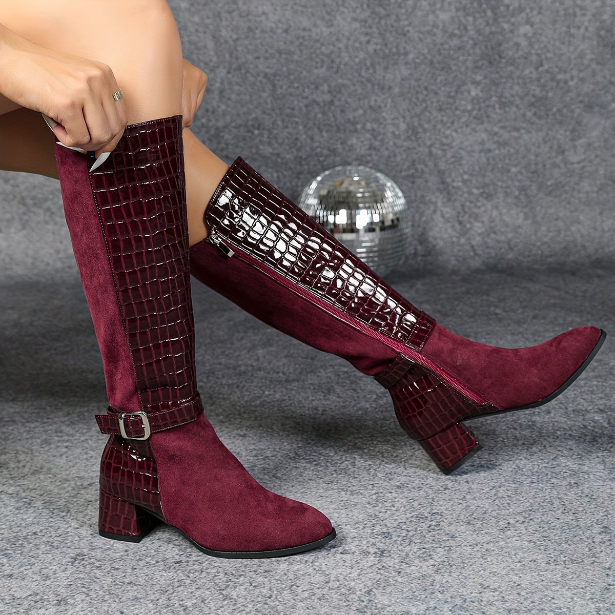 Wine red mid-heeled boots with pointed joints and side zippers, knee-high plush winter boots for a knightly look.