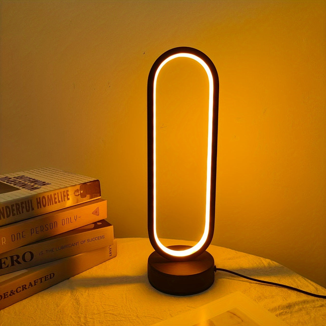 USB-powered LED ring table lamp in black or white; dimmable for bedroom and living room decor.