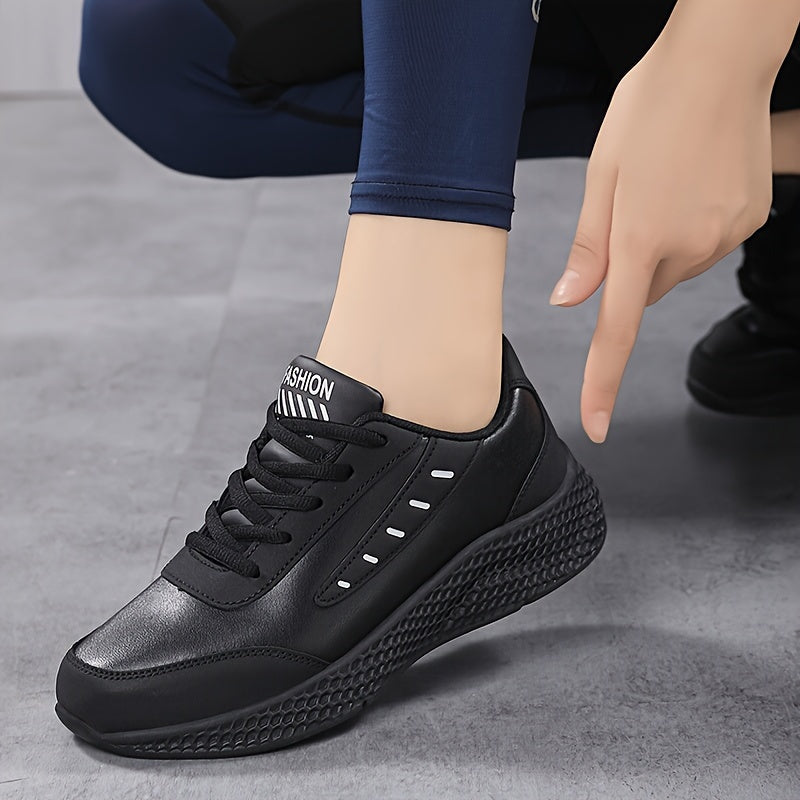 Black platform sneakers for women with lace-up design and comfortable fit, suitable for outdoor activities.