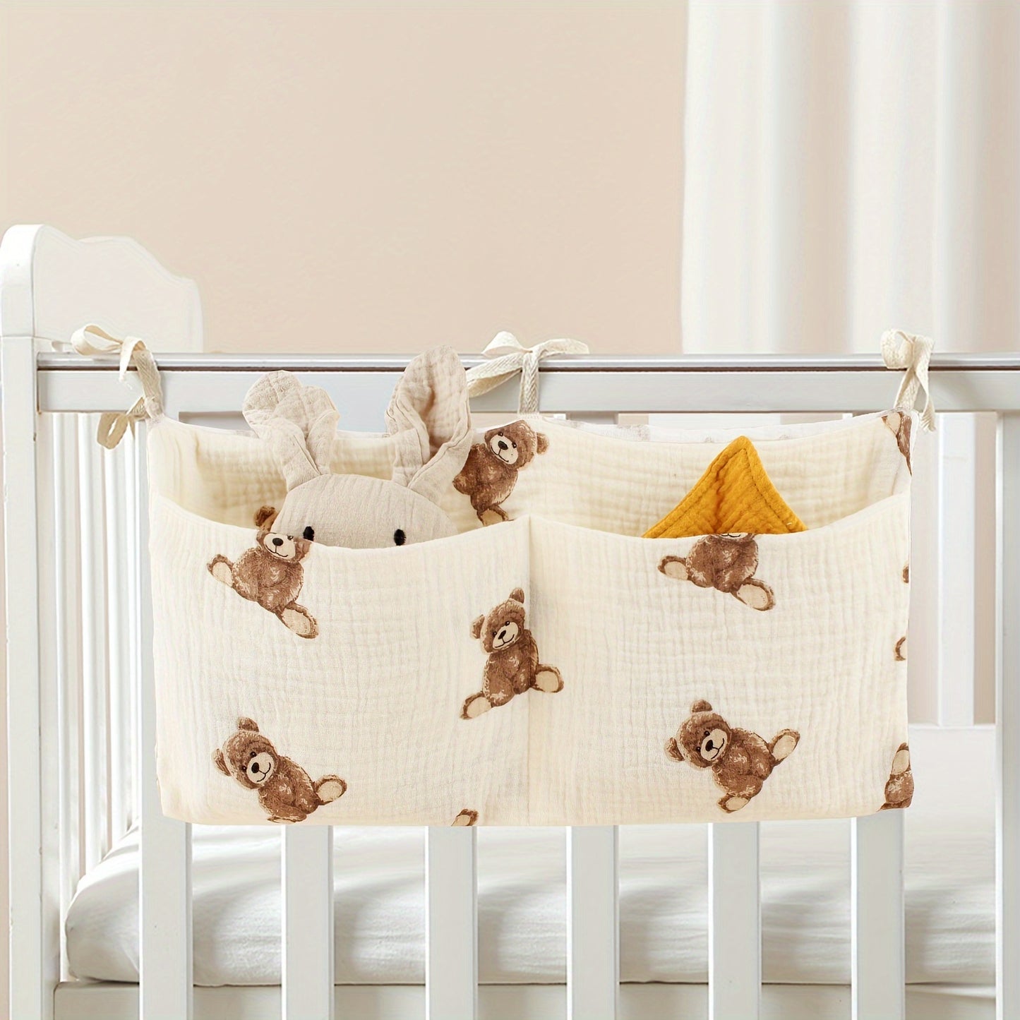 Double-layer fabric hanging storage bag with two stroller pockets, ideal for holding baby bottles with printed patterns.