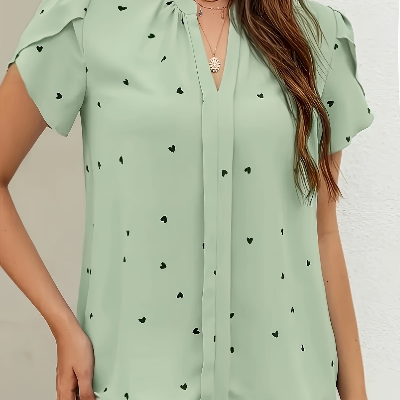 Light blue heart pattern V-neck blouse for women in casual polyester/spandex, available in petite sizes, machine washable, everyday fashion with smooth texture.