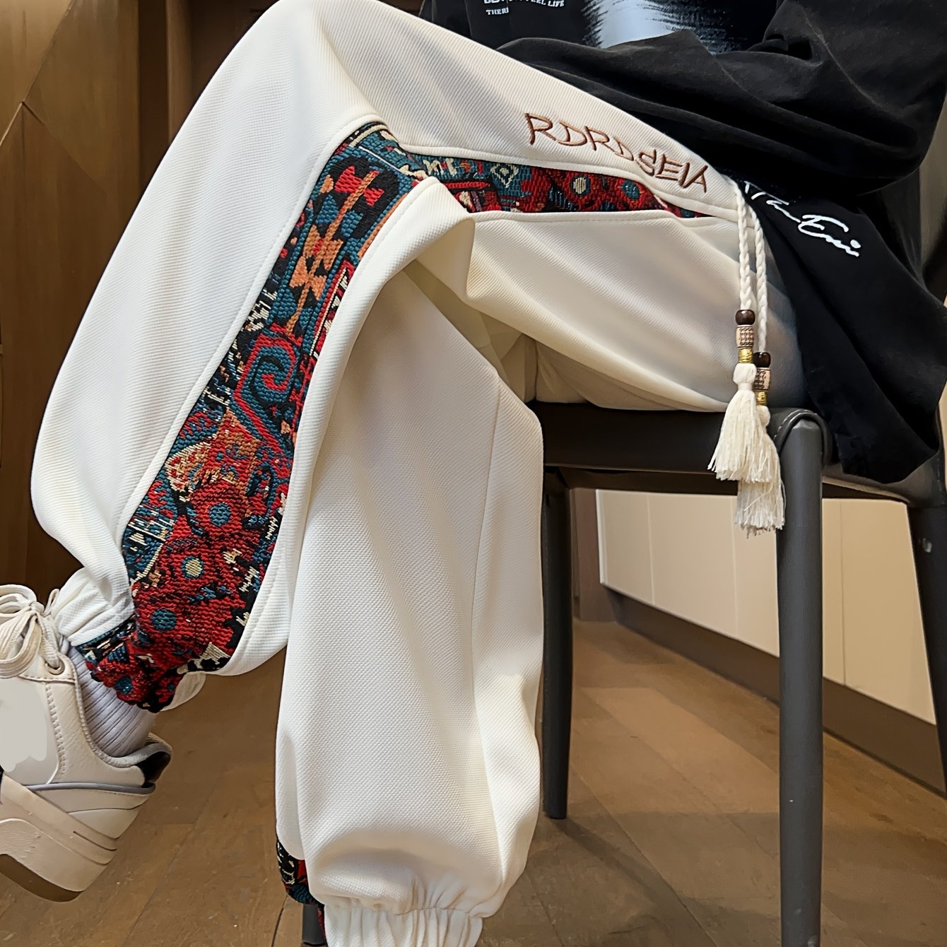 Men's stylish long pants with ethnic style patchwork and letter embroidery, casual jogger sports trousers.