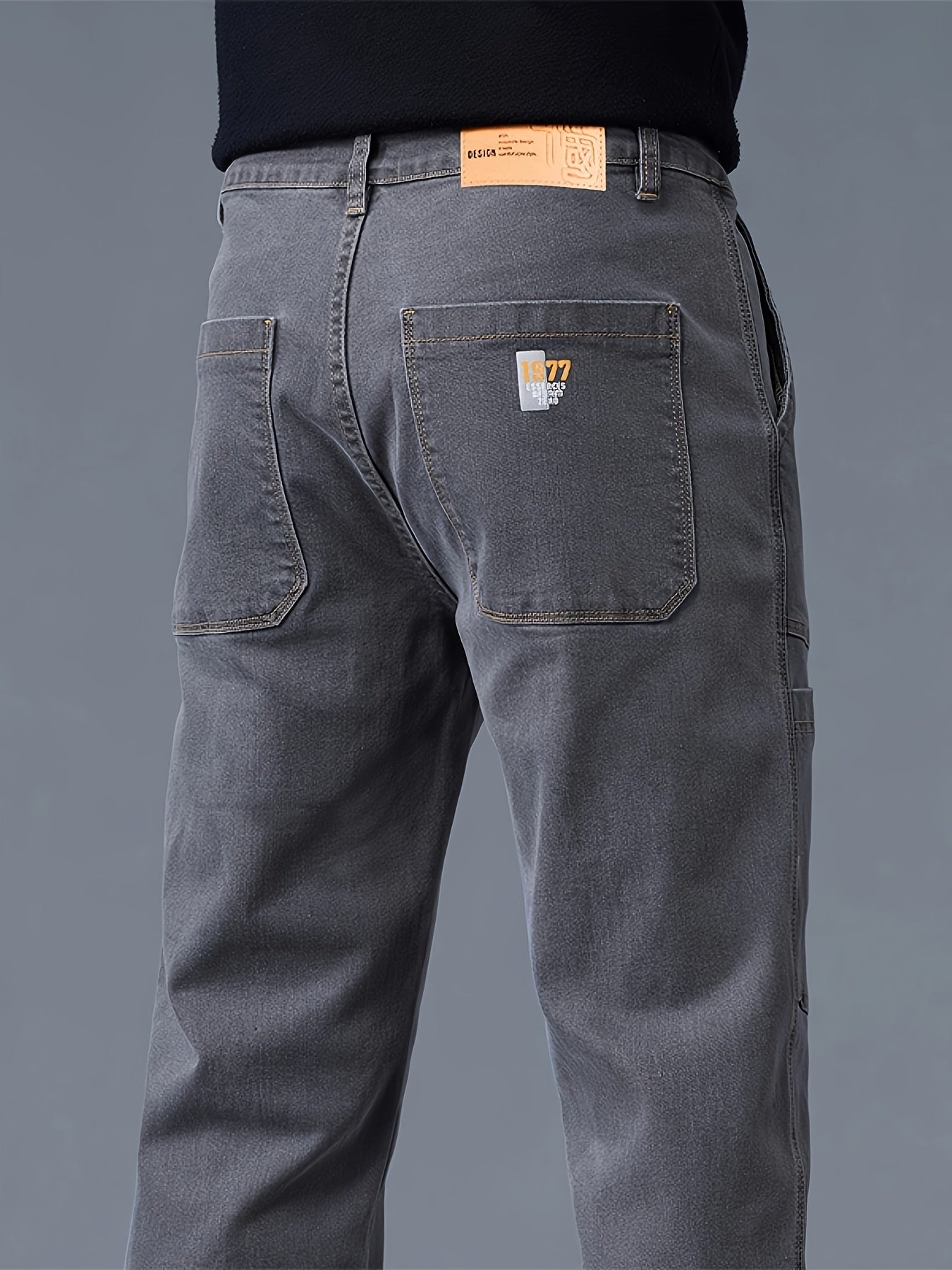 Men's fashion denim jeans made of 70% cotton, 28% polyester, and 1.3% elastane. Features a regular fit, mid waist, zipper fly, and all-season wear. Constructed with 300g/m² woven fabric