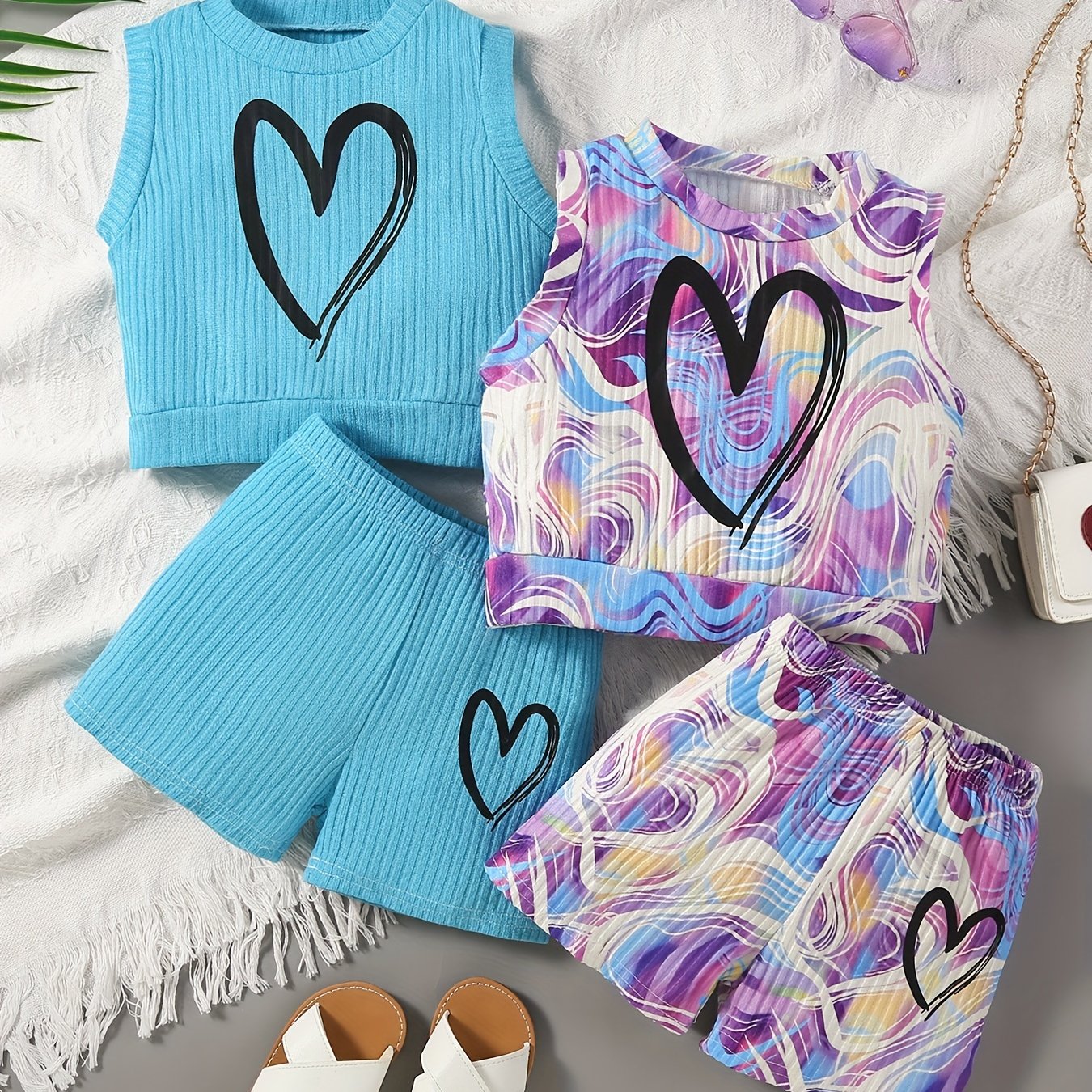 4-piece girls' summer outfit set featuring a strapless heart print tank top and shorts. Made of casual polyester knit fabric with medium stretch for a loose fit. Ideal for outdoor