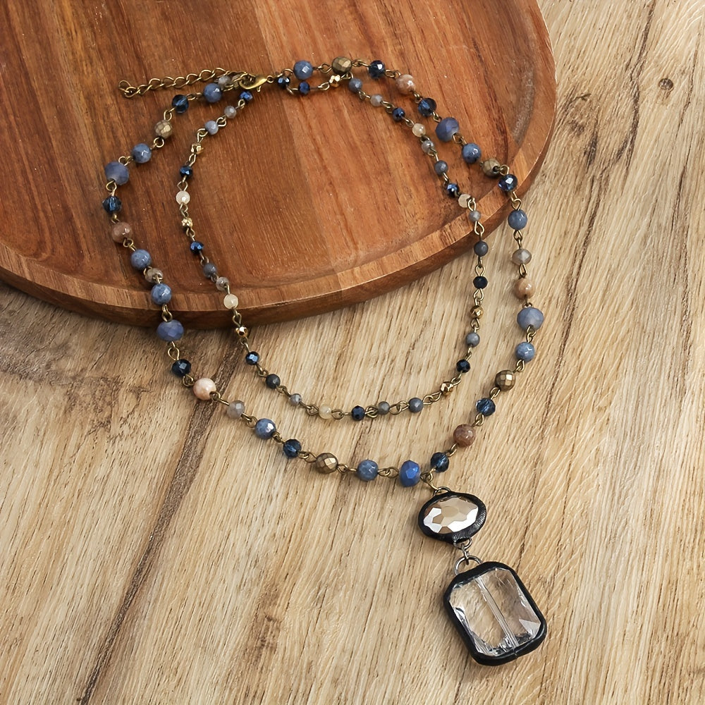 New tribal style necklace featuring two layers of natural stone crystals and glass chains, with a square glass pendant designed for daily wear by both men and women during the spring and summer seasons.