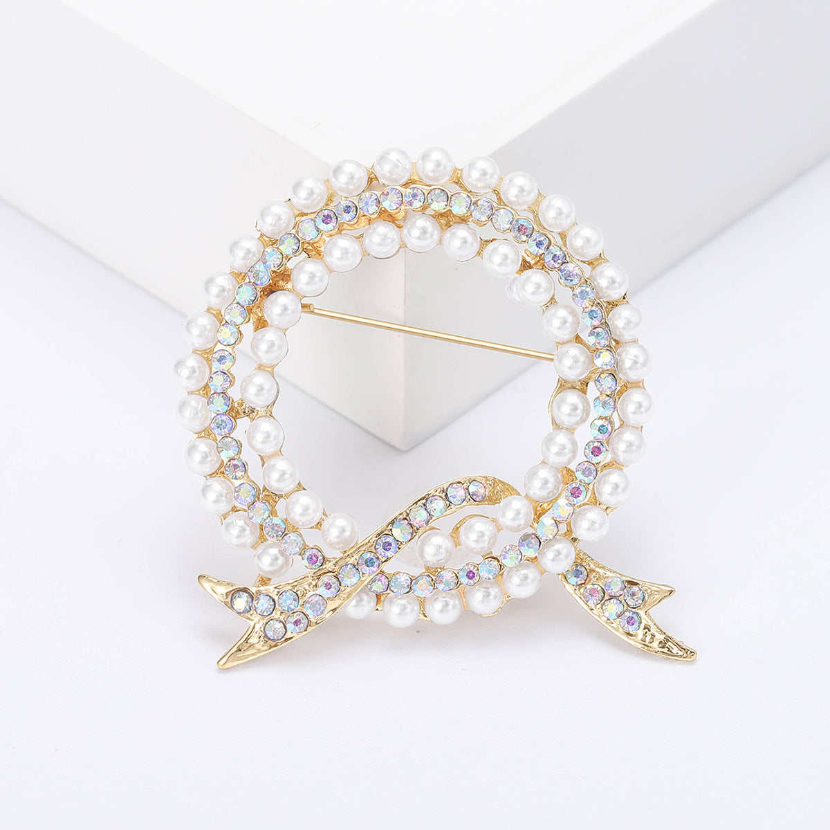 Luxurious and elegant rhinestone brooch pin featuring a unique irregular shape design, inspired by Korean fashion aesthetics. Perfect accessory for women who appreciate novelty and sophistication.