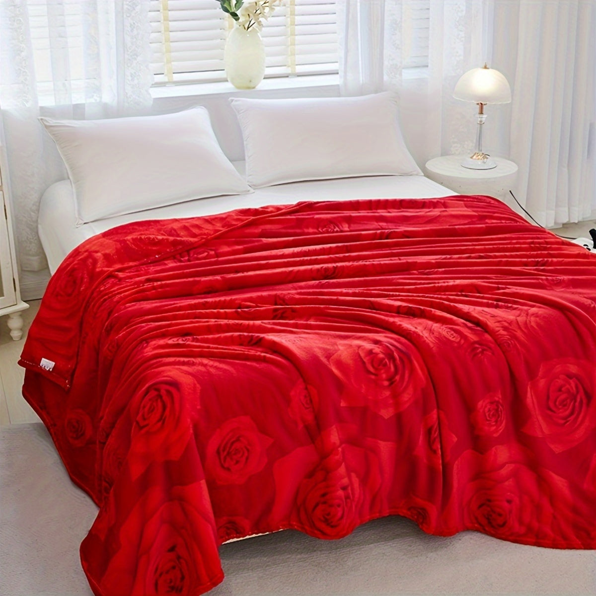 Soft warm knitted floral blanket in contemporary style with vibrant flower design. This all-season multipurpose polyester bed blanket is machine washable, featuring an embellished flower pattern.