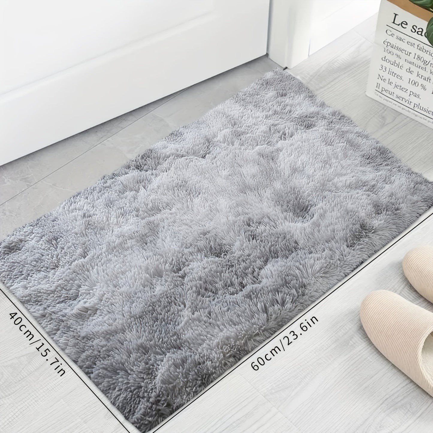 Soft and cozy shaggy area rug perfect for bedroom or living room decor. This plush light gray rug measures 160.02cm x 80.01cm and features a rectangular tie-dye design. Made of machine-washable polyester, this rug is ideal for dorm rooms and homes. Add a