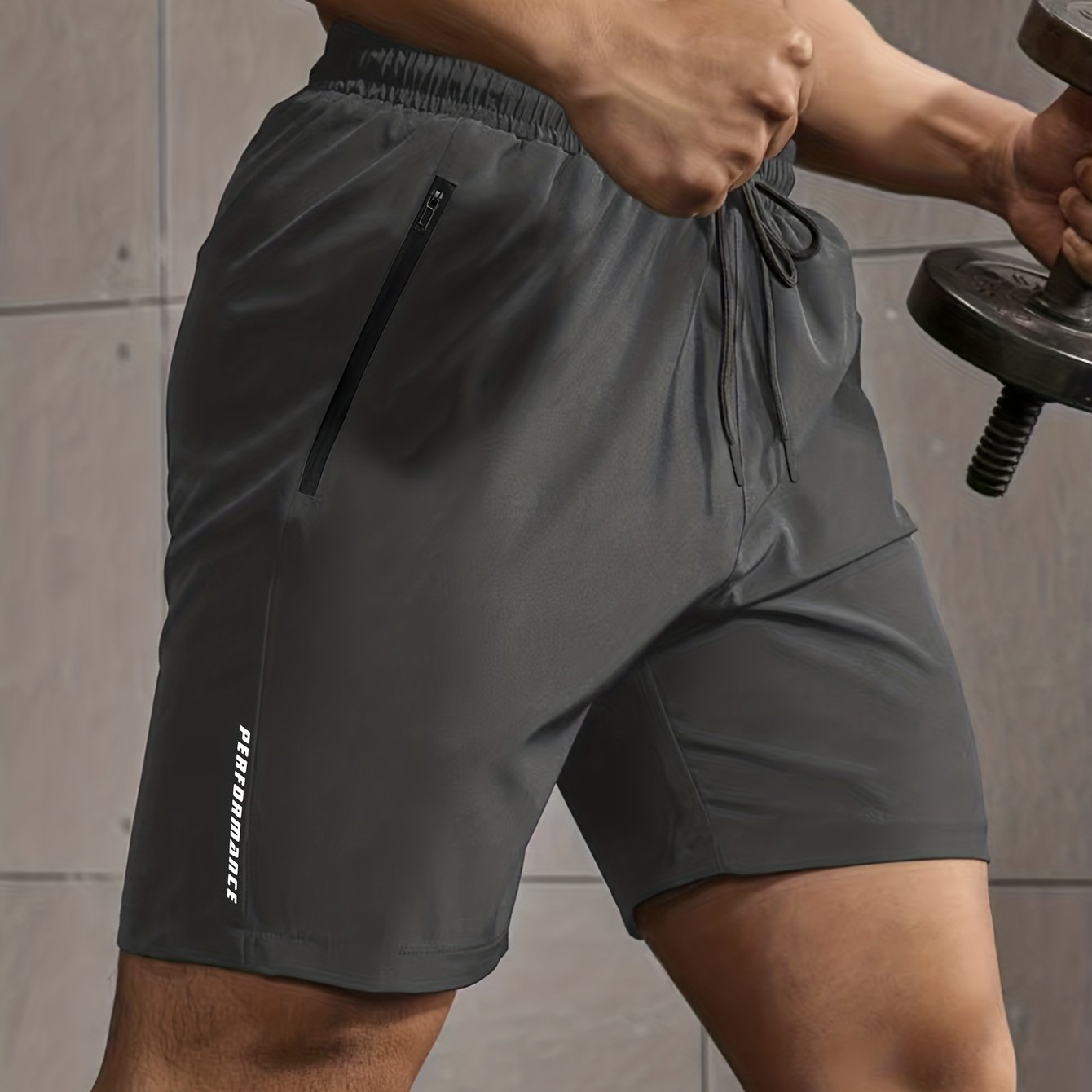 Men's casual style shorts with zip pockets, drawstrings, and performance letter print, ideal for summer outdoor activities.