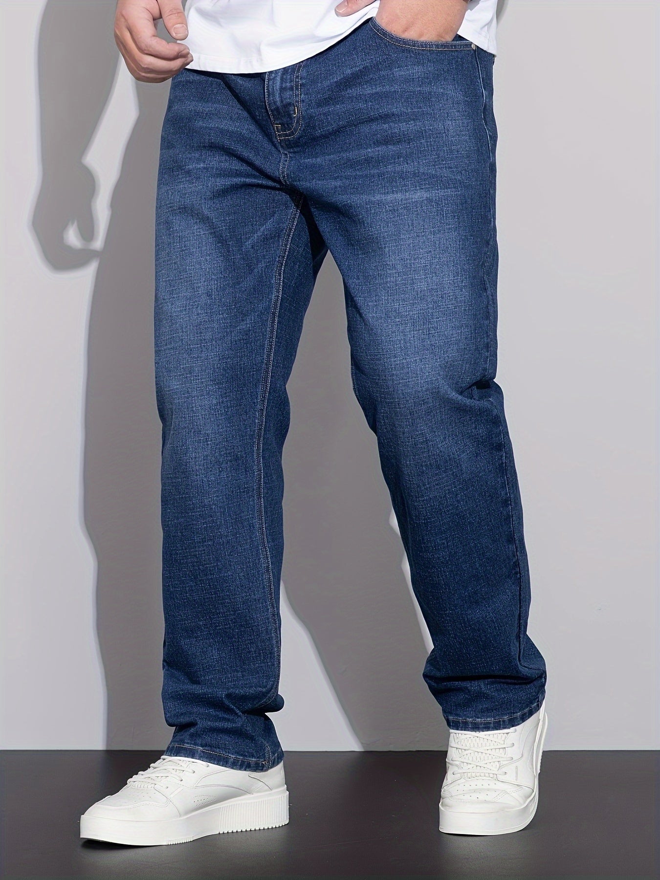 Cotton denim jeans for men in plus sizes, designed for comfort in all seasons with a regular fit.