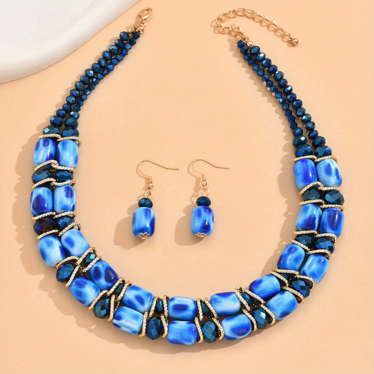 Complete your look with this Bohemian-style women's jewelry set featuring a 2-strand beaded necklace and earrings, suitable for everyday wear or special events.