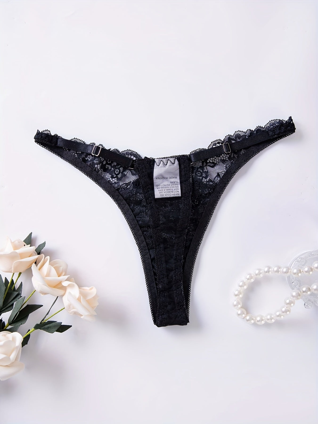 Women's sexy lingerie and underwear, featuring floral lace thongs and low waist bow tie panties with cut-out details.