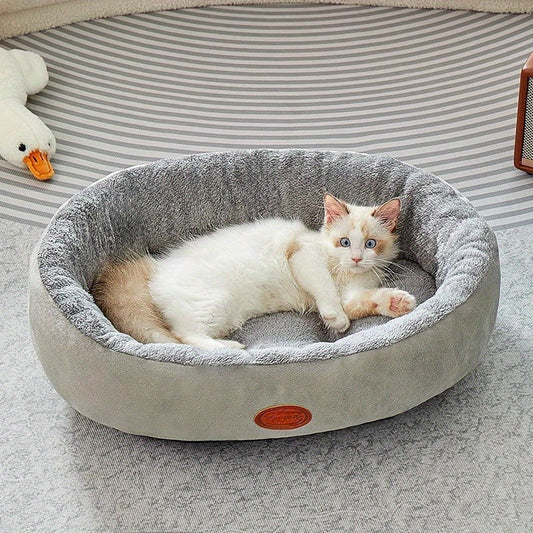 Comfortable oval pet bed for cats and dogs, suitable for all seasons with classic design.