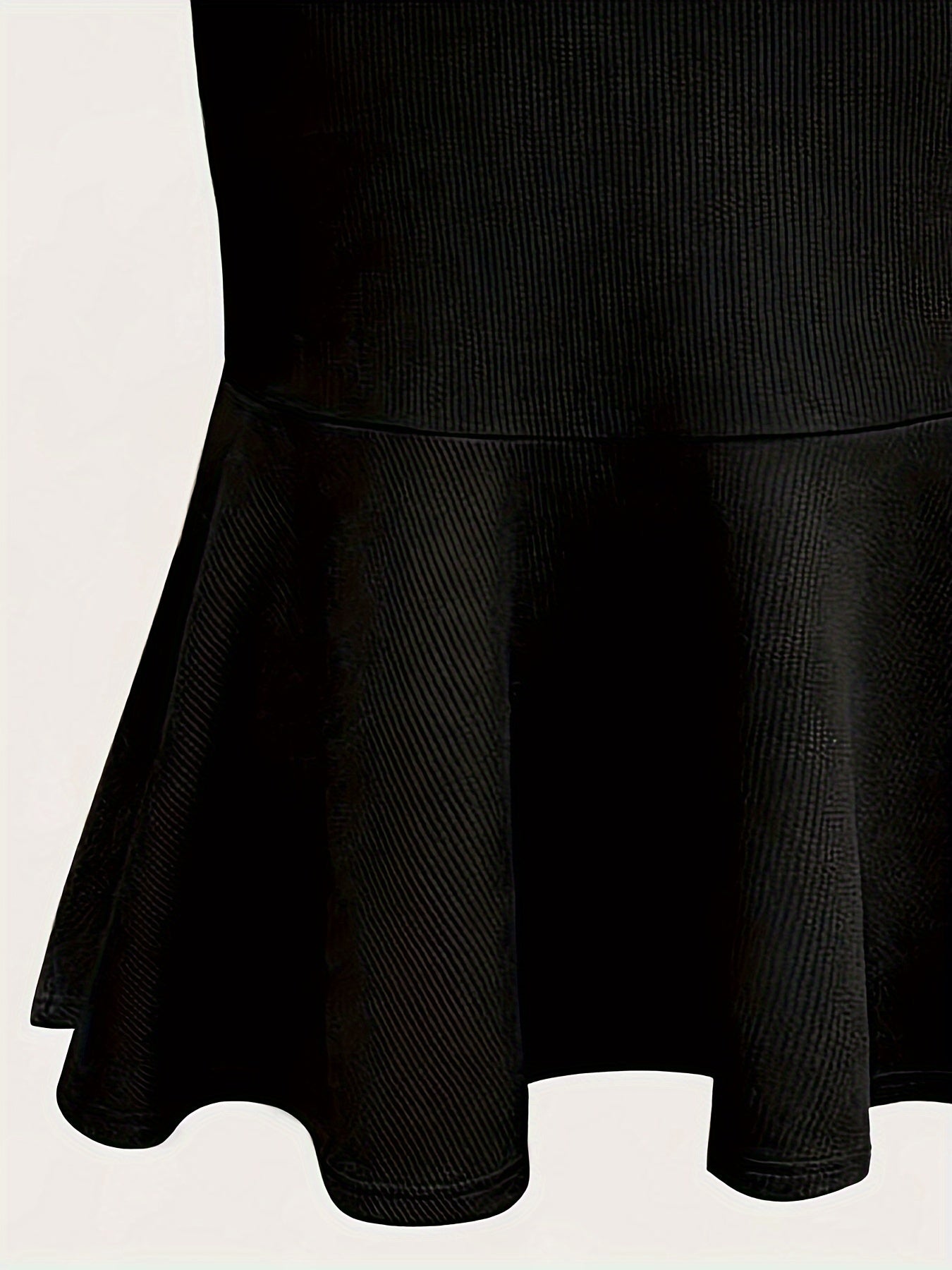 Elegant black mermaid skirt with ruffled hem for all occasions. Made of polyester knit fabric.