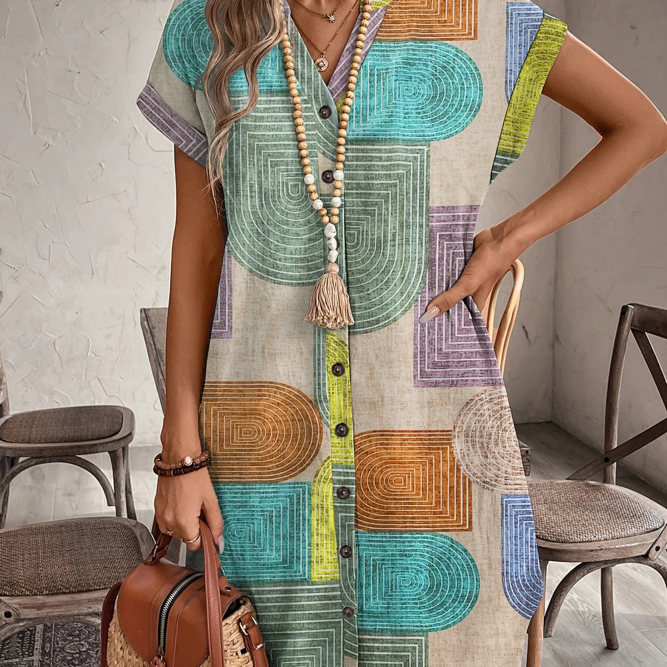 Geometric print V-neck dress with buttons in polyester, suitable for all seasons. Casual yet elegant attire with a cute woven texture.