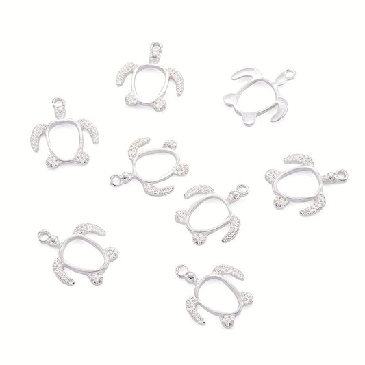 Twenty pieces of silvery turtle alloy pendants with an open back bezel tray, perfect for creating DIY UV resin, epoxy resin, and pressed flower jewelry. Each pendant measures 21.5x18.5x2.5mm with a 2mm hole.