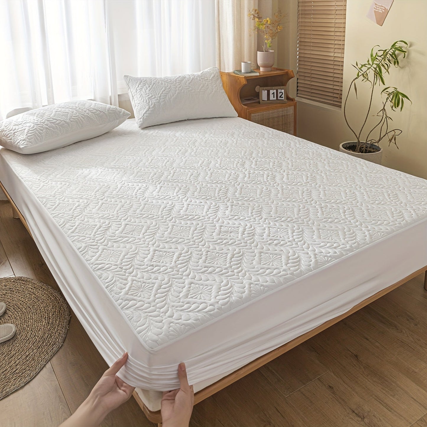 One set of two pieces of 100% waterproof mattress protector pillowcases made of 3D air bamboo fabric. The mattress cover is designed to provide cooling and is smooth, soft, and breathable. It is noiseless and washable, with a deep pocket size ranging