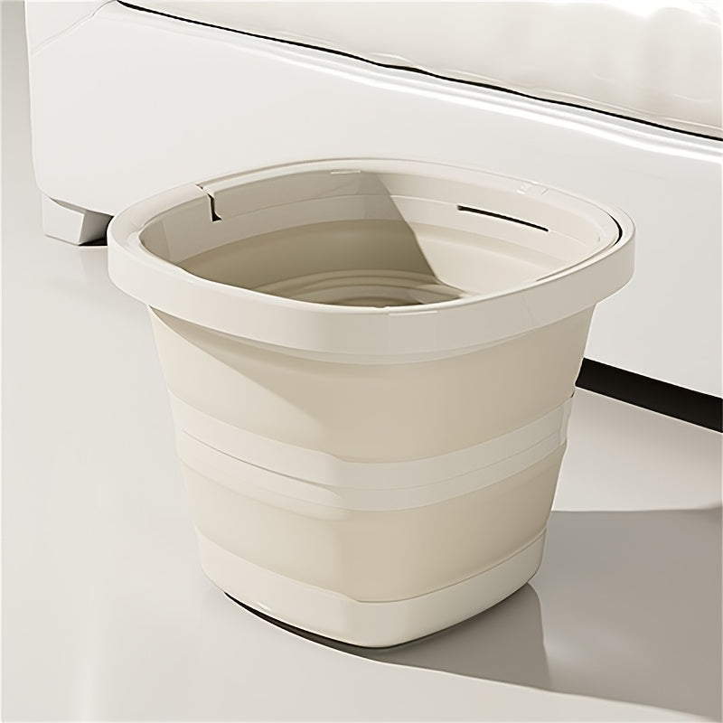 Durable folding bucket with handle, space-saving design. Portable for car wash, camping, fishing, and home use. Creamy white and granny grey plastic bucket.