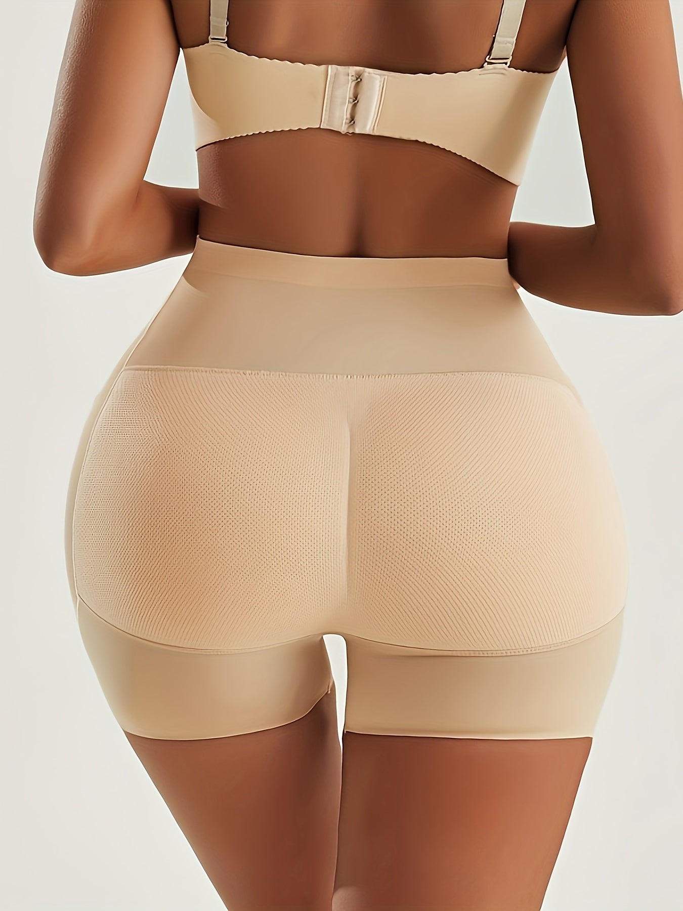 High waist shaping shorts for women made of 82.90% polyamide and 17.10% elastane knit fabric. Features solid color with contrast mesh, medium support, butt lifter, and tummy control. No