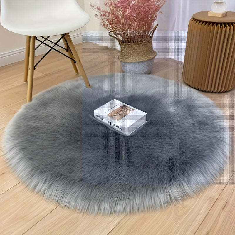 Round luxury area rug made from soft faux fur material with high pile and knit weave, machine washable, lightweight and fluffy. Crafted from a blend of polyester and acrylic in a solid color design. Perfect for adding a cozy touch to bedroom, living