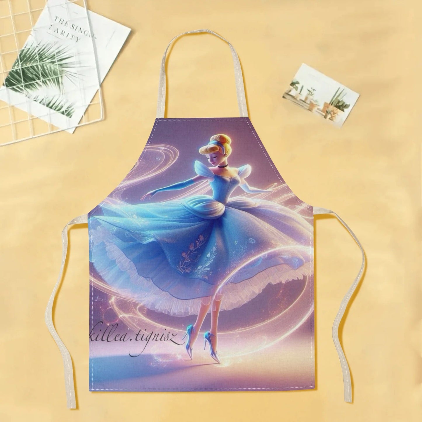 Waterproof apron featuring Disney's Cinderella cartoon character in a vibrant blue dress with a floral design. Made of durable polyester, perfect for use in hotels, supermarkets, restaurants, fruit shops, milk tea stands, and at home.