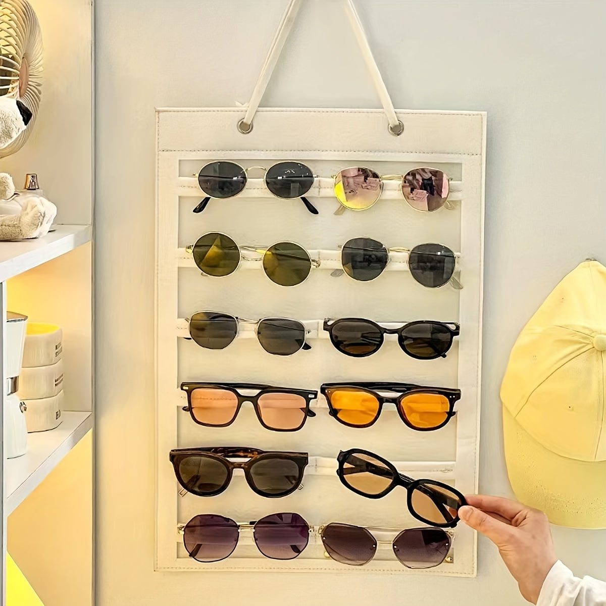 Organize your sunglasses with this hanging wall organizer featuring 12 slots made of felt. Keep your glasses dust-proof and easily accessible with this storage display pocket wall stand holder.