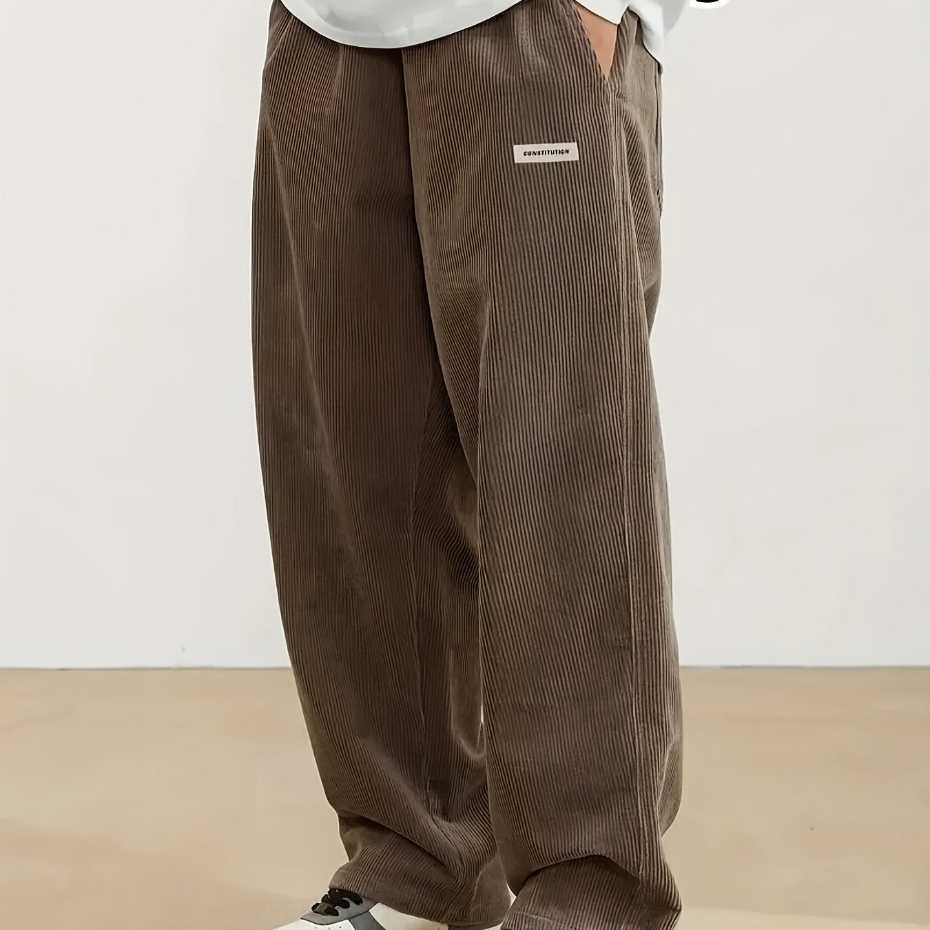 Men's plus size corduroy pants with pocket detail for fall/winter, featuring a letters print.