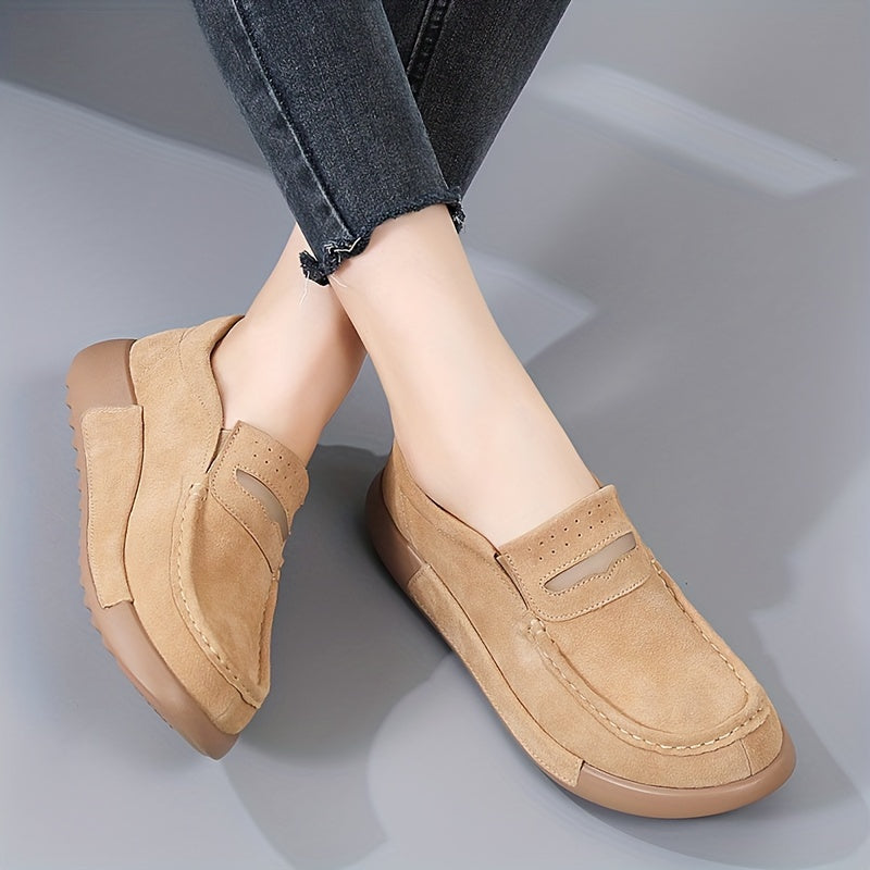 Women's slip-on loafers in solid color with round toe, casual low-top design.