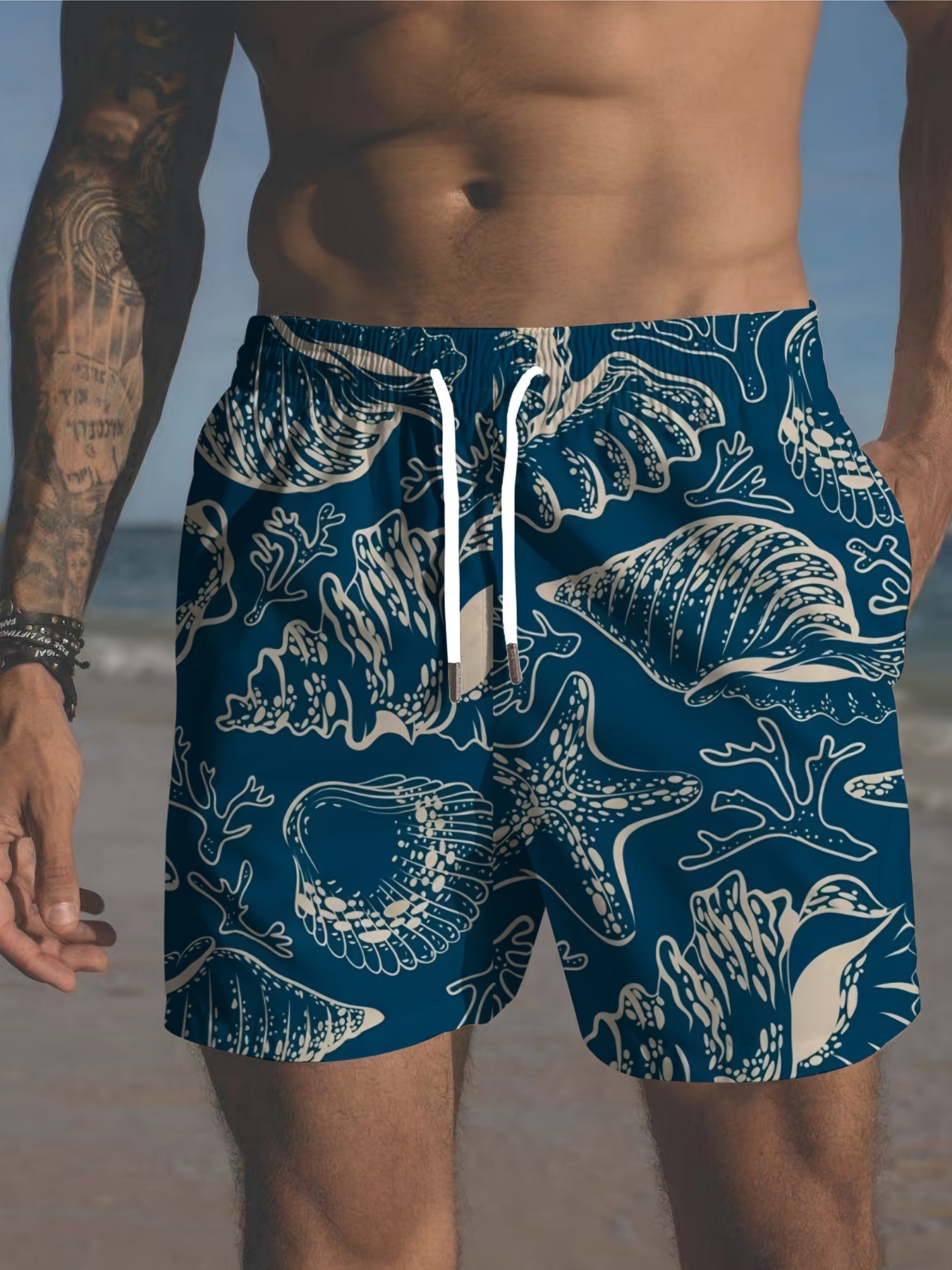 Plus size men's beach shorts with tropical print, elastic drawstring waist and pockets.