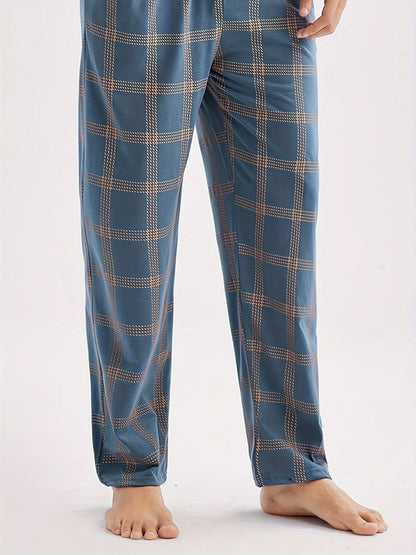 Men's casual blue short-sleeve top and plaid long pants set made of soft polyester for loungewear at home or out.