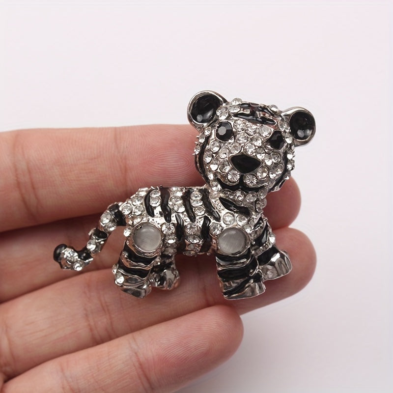 Irregularly shaped, vintage tiger brooch pin with rhinestone accent features a cute tiger design, perfect for men's suit jacket lapels.